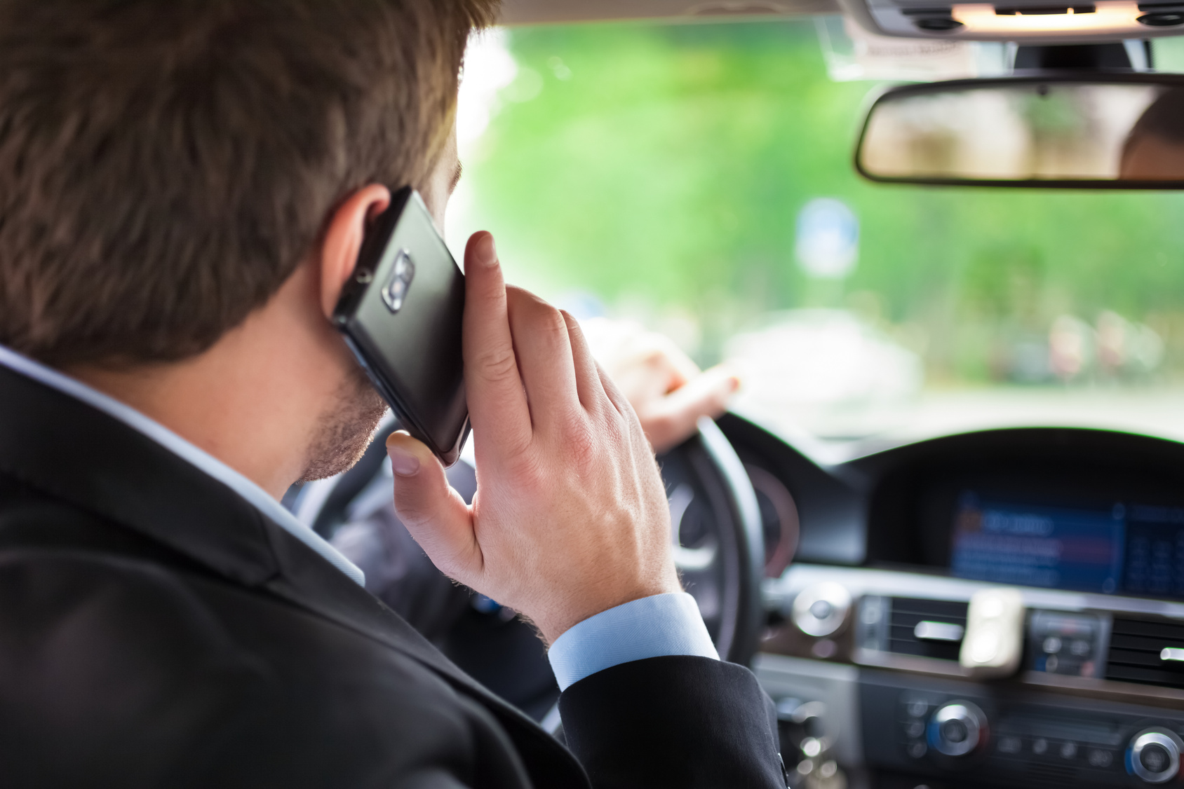 Business driver goes to meeting comforted by the fact that he has commercial auto insurance